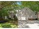Traditional home with neutral siding, attached two-car garage, and mature landscaping at 9141 Covey Hollow Ct, Charlotte, NC 28210