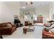 Expansive living room with a fireplace, grand staircase, and views of the front entryway at 9141 Covey Hollow Ct, Charlotte, NC 28210
