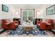 Sitting area highlighting leather chairs, a stone coffee table, and a decorative rug at 9141 Covey Hollow Ct, Charlotte, NC 28210