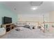 Spacious loft area with casual seating, soft textures, and plenty of natural light at 9141 Covey Hollow Ct, Charlotte, NC 28210