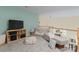 Cozy upstairs loft sitting area with neutral tones and comfortable seating arrangement at 9141 Covey Hollow Ct, Charlotte, NC 28210