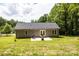 Spacious backyard with patio, plush lawn, surrounded by lush trees, ideal for outdoor entertaining at 1005 8Th Sw Ave, Conover, NC 28613