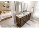 Ensuite bathroom features a double sink vanity with granite countertop and views of the main bedroom at 1005 8Th Sw Ave, Conover, NC 28613