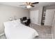 Bedroom with ceiling fan, carpeted floor, closet and desk workspace at 1005 8Th Sw Ave, Conover, NC 28613