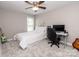 Cozy bedroom with ceiling fan, carpeted floor and dedicated desk workspace at 1005 8Th Sw Ave, Conover, NC 28613