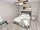 This bedroom is carpeted and features a ceiling fan and neutral colors at 1005 8Th Sw Ave, Conover, NC 28613