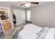 Bright carpeted bedroom with ceiling fan and a bench by the window at 1005 8Th Sw Ave, Conover, NC 28613
