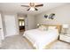 Bright bedroom features a ceiling fan, soft carpet, and neutral paint at 1005 8Th Sw Ave, Conover, NC 28613