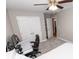 Bedroom with ceiling fan, carpet, and large closet and desk workspace at 1005 8Th Sw Ave, Conover, NC 28613