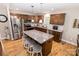 Charming kitchen boasts wood cabinets, granite countertops, stainless steel appliances, and a center island with bar stool seating at 1005 8Th Sw Ave, Conover, NC 28613