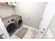 Laundry room with tile floor and newer washer and dryer units at 1005 8Th Sw Ave, Conover, NC 28613