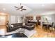 Open-concept living room, with hardwood floors, high ceilings, and seamless flow to the kitchen and dining area at 1005 8Th Sw Ave, Conover, NC 28613