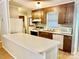 Traditional kitchen with a breakfast bar, wood cabinetry, and laminate countertops at 1010 Macarthur Rd, Albemarle, NC 28001
