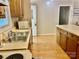Practical kitchen featuring a double sink, adjacent counters, and wood cabinetry at 1010 Macarthur Rd, Albemarle, NC 28001