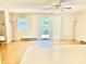 Bright living room featuring wood floors, ceiling fan and sliding glass doors to the outside at 1010 Macarthur Rd, Albemarle, NC 28001