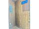 Utility room featuring wood paneling, electrical panel, and storage for tools at 1010 Macarthur Rd, Albemarle, NC 28001