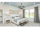 Cozy main bedroom with large windows, neutral decor, and a decorative chandelier at 1022 Kinship Dr # 118, Lancaster, SC 29720