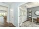 Bright home office with open doorway, french doors, wood floors, gray accent wall and white trim at 1022 Kinship Dr # 118, Lancaster, SC 29720