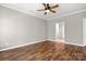 Bedroom features hardwood floors, fan and ensuite bathroom at 1031 Fants Grove Ln, Indian Land, SC 29707