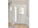 Bright entryway featuring a white door with decorative glass insert and neutral-toned walls at 1031 Fants Grove Ln, Indian Land, SC 29707