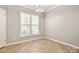 Bright room featuring neutral walls, tile flooring, and a large window with stylish shutters at 1031 Fants Grove Ln, Indian Land, SC 29707
