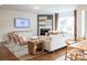 Bright living room with fireplace, modern furnishings, hardwood floors, and a large window at 1041 Waxhaw Crossing Dr # 058, Waxhaw, NC 28173