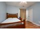 Comfortable bedroom with a bed, ceiling fan, and closet at 10614 Hill Point Ct, Charlotte, NC 28262