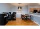 Inviting dining area with wood floors is located next to a dedicated office space and functional kitchen at 10614 Hill Point Ct, Charlotte, NC 28262