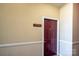 Condo entrance with painted door, trim, and unit number displayed at 10614 Hill Point Ct, Charlotte, NC 28262