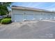 Row of multiple garages in a tan multi-Gathering home at 10614 Hill Point Ct, Charlotte, NC 28262