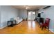 Spacious living room with hardwood floors, neutral colors, and double doors to the outside at 10614 Hill Point Ct, Charlotte, NC 28262