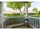 Covered porch with two chairs overlooking green landscaping and greenery at 10614 Hill Point Ct, Charlotte, NC 28262