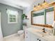 Cozy bathroom featuring a vanity with a framed mirror at 11126 Windgate Ct, Tega Cay, SC 29708