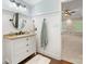 Bright bathroom featuring dark wood floors and a vanity with stone countertop at 11126 Windgate Ct, Tega Cay, SC 29708