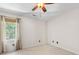 Empty bedroom features a window with a woven shade at 11126 Windgate Ct, Tega Cay, SC 29708