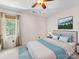 Staged bedroom featuring a bed with blue accents and a nature painting at 11126 Windgate Ct, Tega Cay, SC 29708