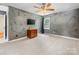 Spacious bedroom features neutral carpet, decorative ceiling fan and a flat screen television at 11126 Windgate Ct, Tega Cay, SC 29708