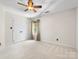 Carpeted bedroom features a window and a closet behind double doors at 11126 Windgate Ct, Tega Cay, SC 29708