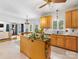 Bright kitchen with stainless steel appliances, wooden cabinetry, granite countertops, and a spacious island at 11126 Windgate Ct, Tega Cay, SC 29708
