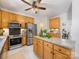 Bright kitchen with stainless appliances, granite countertops, and light wood cabinetry at 11126 Windgate Ct, Tega Cay, SC 29708