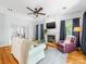 Inviting living room with hardwood floors, cozy fireplace, and large windows for natural light at 11126 Windgate Ct, Tega Cay, SC 29708