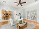 Cozy living room with hardwood floors and open view of the kitchen and entry foyer at 11126 Windgate Ct, Tega Cay, SC 29708