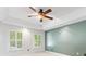 Spacious main bedroom featuring a trey ceiling, and large windows for bright, natural light at 11126 Windgate Ct, Tega Cay, SC 29708