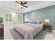 Well-lit main bedroom with a trey ceiling, neutral colors, and ample natural light at 11126 Windgate Ct, Tega Cay, SC 29708