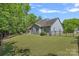 Well-maintained backyard with lush lawn, fenced perimeter, and mature trees at 1209 Shelly Woods Dr, Indian Land, SC 29707