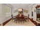 Dining room with natural light, a large china cabinet, and wainscoting at 1209 Shelly Woods Dr, Indian Land, SC 29707