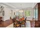 Elegant dining room features a chandelier, a large window, and detailed woodwork at 1209 Shelly Woods Dr, Indian Land, SC 29707