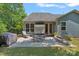Charming patio with ample seating, perfect for outdoor dining and entertaining at 1209 Shelly Woods Dr, Indian Land, SC 29707