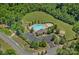 Aerial view of community pool with ample parking and surrounding green space at 1209 Shelly Woods Dr, Indian Land, SC 29707