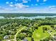 Beautiful aerial view of a waterfront community with lush greenery and lakeside homes at 132 Broadbill Dr, Mooresville, NC 28117